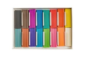 Modeling clay. Multicolored plasticine bars in a box isolated on white background. photo