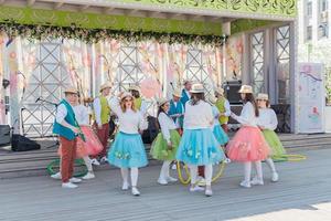 Moscow, Russia, 2019 - Young actors in colorful clothes at Easte Holidays Festival. photo