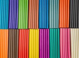 Rainbow colors of modeling clay. Multicolored plasticine bars background. photo