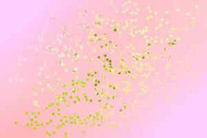 Gold star glitter on pink pastel background. Festive concept. Place for design. photo