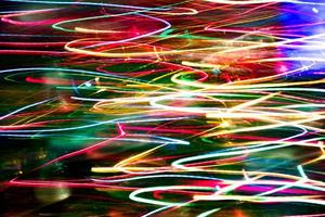 Abstract burred texture background of colorful bokeh motion. Long exposure of small neon lights photo