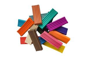 Rainbow colors of modeling clay. Multicolored plasticine bars isolated on white background. photo