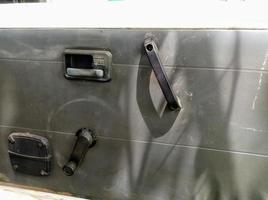 interior door panels in an old car in gray color and equipped with original manual handles and window adjusters photo