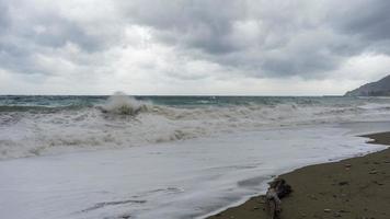 Seascape with overcast skies and stormy waves photo