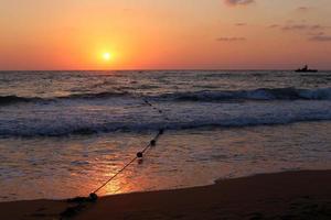 The sun sets below the horizon on the Mediterranean Sea in northern Israel. photo