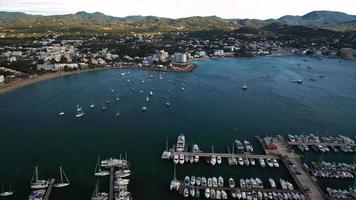 Aerial view of boats in harbor of San Antonio on coast of Ibiza video