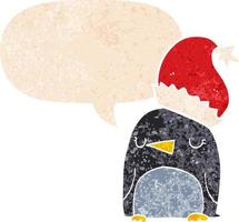 cute christmas penguin and speech bubble in retro textured style vector