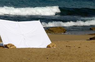 Tourist tent on the Mediterranean coast. photo