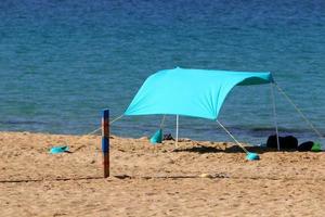 Tourist tent on the Mediterranean coast. photo