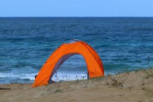 Tourist tent on the Mediterranean coast. photo