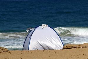 Tourist tent on the Mediterranean coast. photo