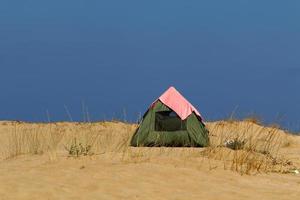 Tourist tent on the Mediterranean coast. photo