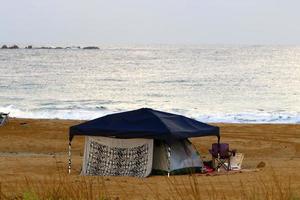 Tourist tent on the Mediterranean coast. photo