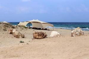 Tourist tent on the Mediterranean coast. photo