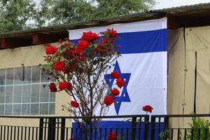 The blue and white Israeli flag with the Star of David. photo