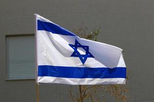 The blue and white Israeli flag with the Star of David. photo