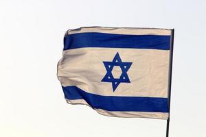 The blue and white Israeli flag with the Star of David. photo