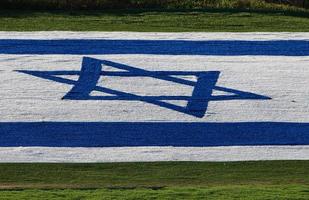 The blue and white Israeli flag with the Star of David. photo