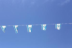 The blue and white Israeli flag with the Star of David. photo