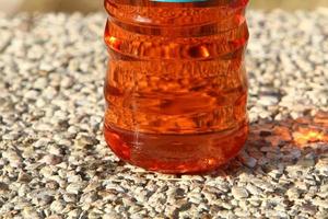 On the table in a glass of soft drinks. photo