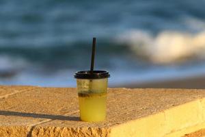 On the table in a glass of soft drinks. photo