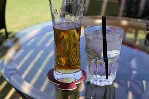 On the table in a glass of soft drinks. photo