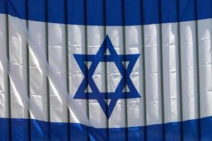 The blue and white Israeli flag with the Star of David. photo