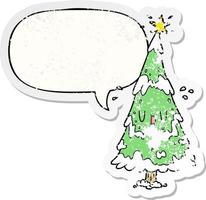 cartoon snowy christmas tree and happy face and speech bubble distressed sticker vector
