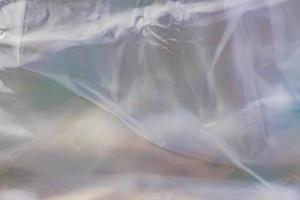 la textura del paquete de polietileno transparente. una superficie cubierta con múltiples capas de celofán. foto