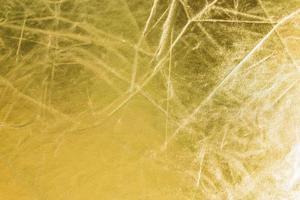 Shiny gold background texture with scratches with copy space photo