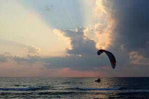 The sun sets below the horizon on the Mediterranean Sea in northern Israel. photo