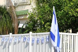 The blue and white Israeli flag with the Star of David. photo