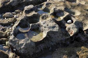 Texture of rocks and stones in a city park in Israel. photo