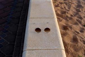 Old glasses are lying in the city park on the seashore. photo