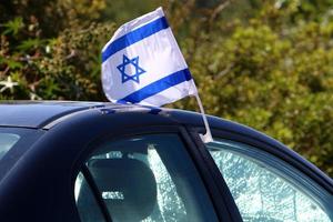 The blue and white Israeli flag with the Star of David. photo