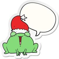 lindo dibujo animado de rana navideña y etiqueta engomada de la burbuja del discurso vector