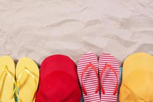 Summer background, summer items on the sand top view - copy space photo
