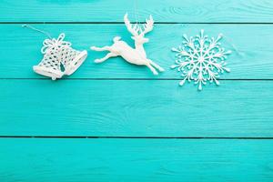 Christmas accessories and copy space on blue wooden background. Top view photo