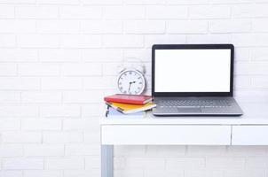 Workspace with laptop and other work accessories with copy space. Blank, template computer screen. Selective focus. Education business concept photo