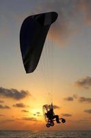 The sun sets below the horizon on the Mediterranean Sea in northern Israel. photo