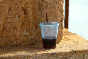 On the table in a glass of soft drinks. photo