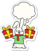 cartoon rabbit with christmas presents and thought bubble as a printed sticker vector