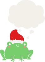 linda caricatura de rana navideña y globo de pensamiento en estilo retro vector