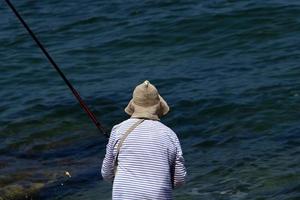 Nahariya Israel June 16, 2020. Man on vacation in a city park near the sea. photo