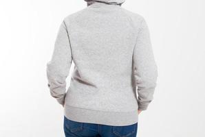 rear view of a woman in a hooded sweatshirt isolated, front cropped image photo