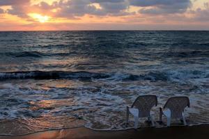 The sun sets below the horizon on the Mediterranean Sea in northern Israel. photo