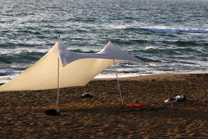 Tourist tent on the Mediterranean coast. photo