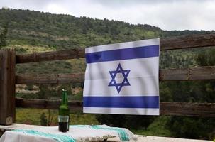 The blue and white Israeli flag with the Star of David. photo