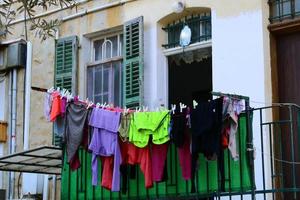 Tel Aviv Israel June 23, 2020 Outside the window, laundry is being dried on a rope on the facade of the building. photo