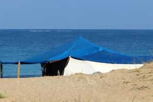 Tourist tent on the Mediterranean coast. photo